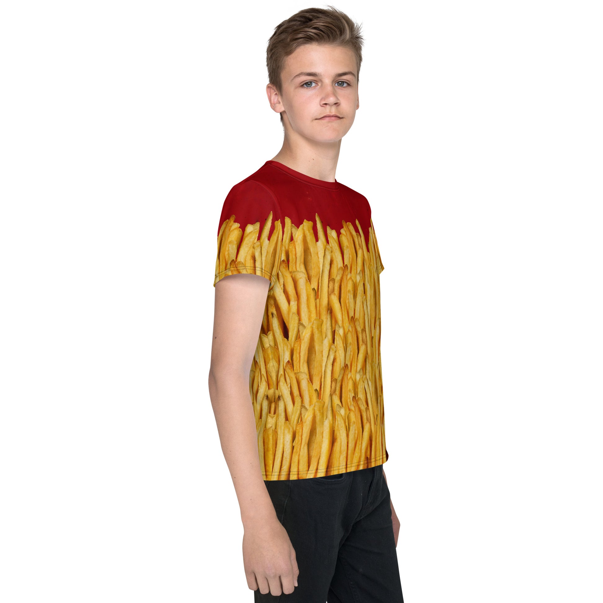 Teenage boy wearing a french fries and ketchup all over print T-shirt, right side view.