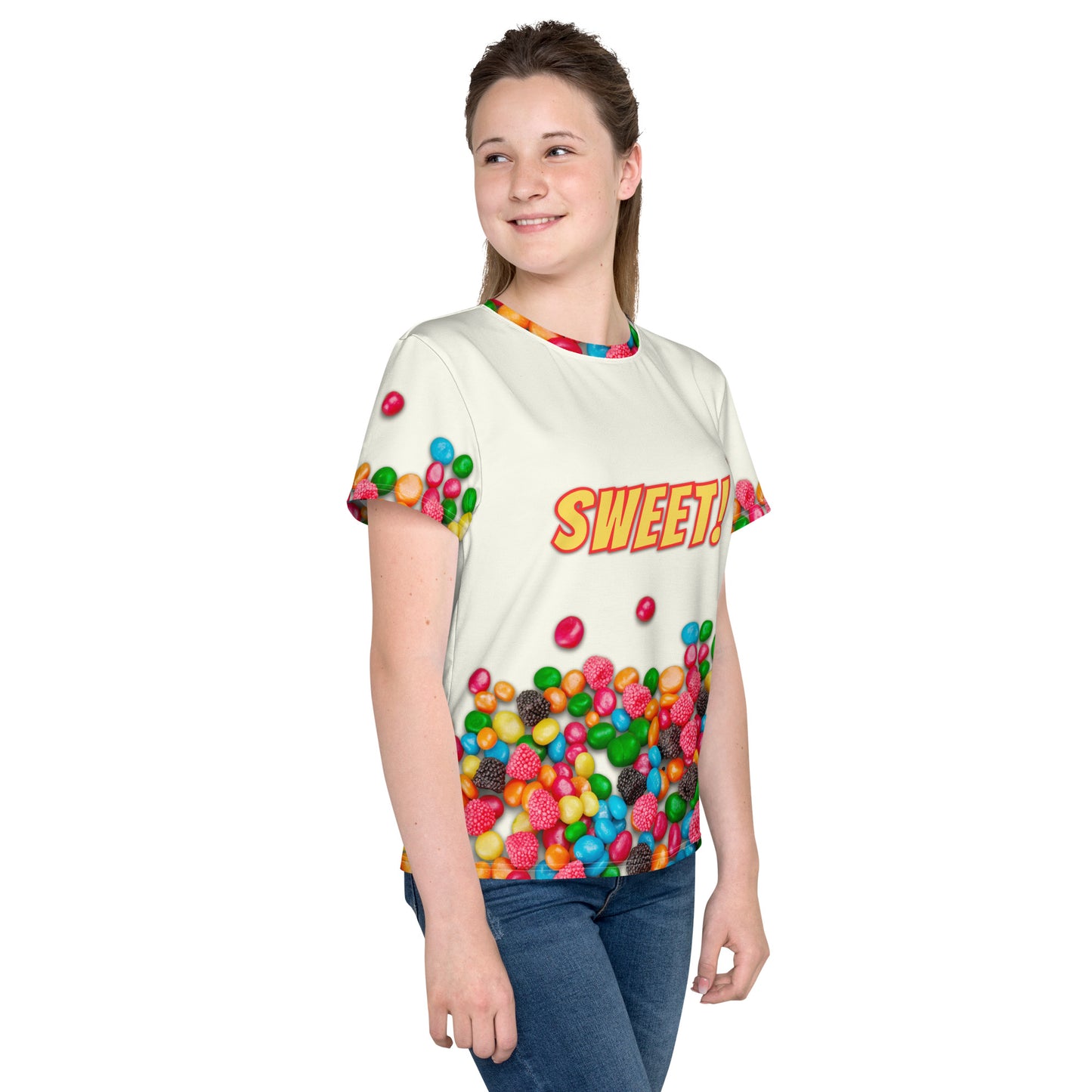 teenage girl wearing sweet as candy sugar high all over print t-shirt, front right view.