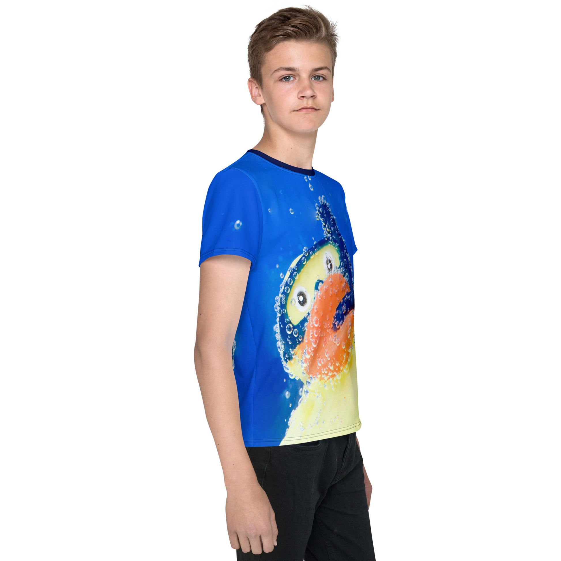 Teenage boy wearing an All over print Rubber Duck Snorkelling Underwater T-shirt, right side view.