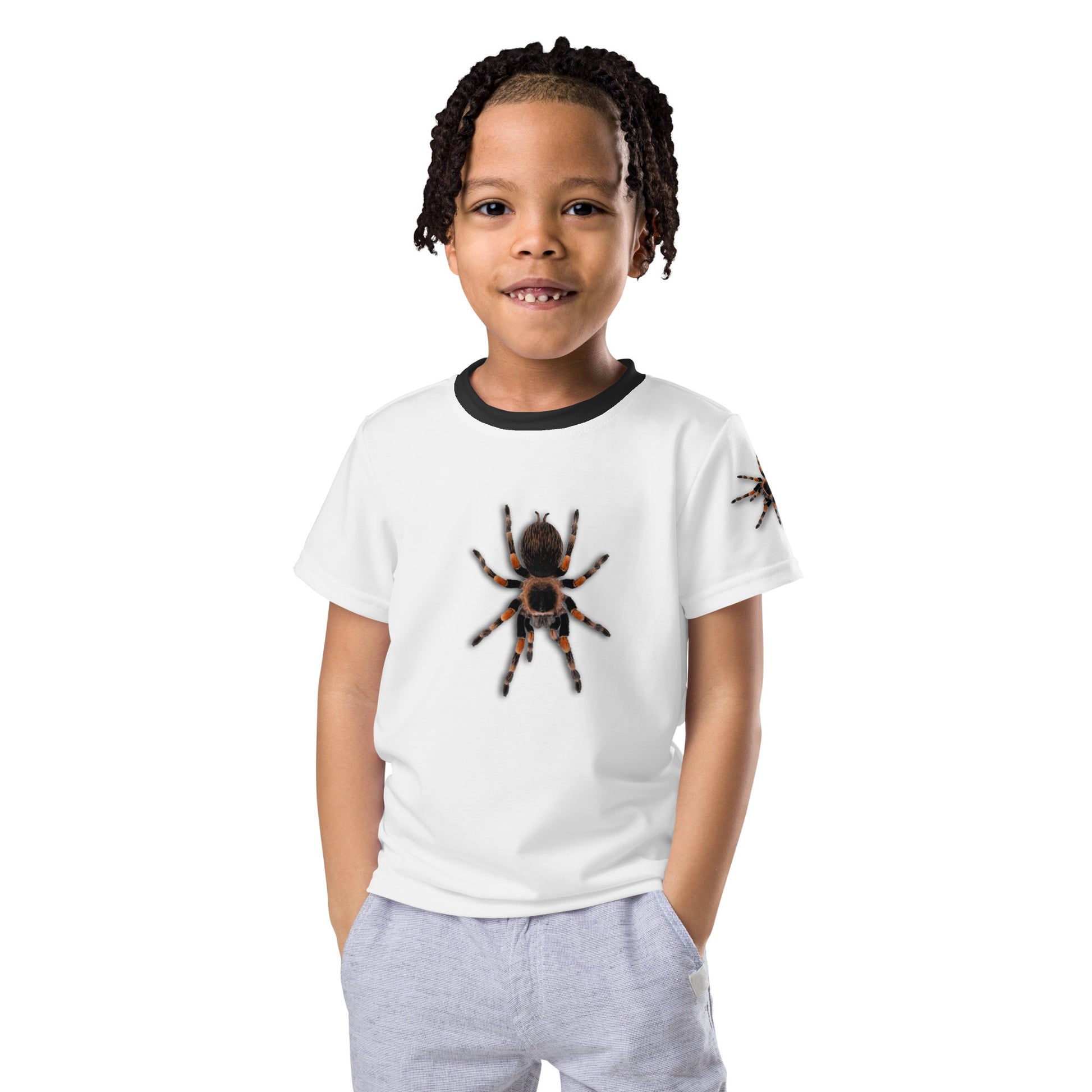 Little boy wearing a 3D Tarantula spider T-shirt with one spider on each arm, front and back of shirt. Facing forward.