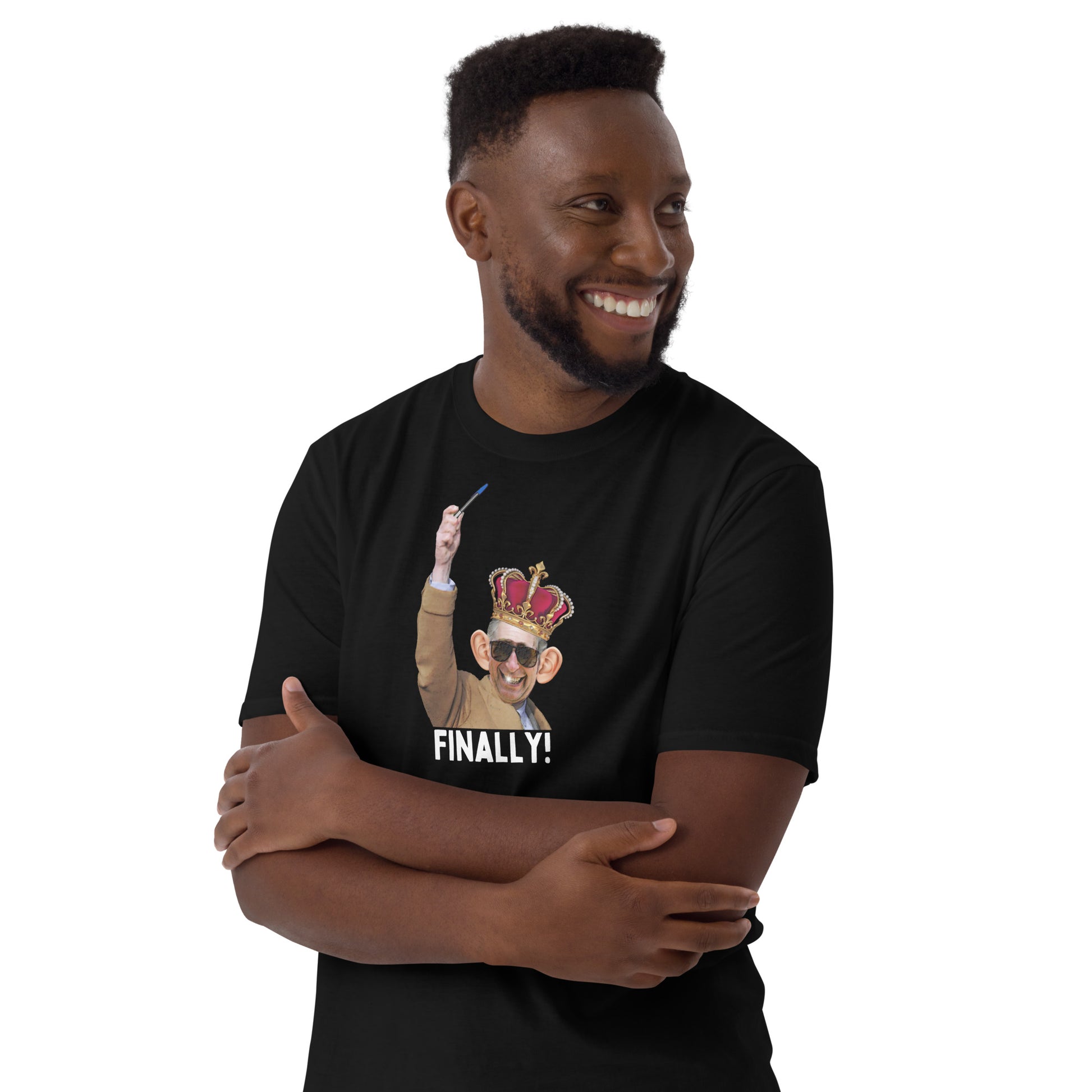 young man wearing a black funny King Charles coronation T-shirt with Charles holding up a biro instead of a leaky ink pen, wearing a wonky crown.