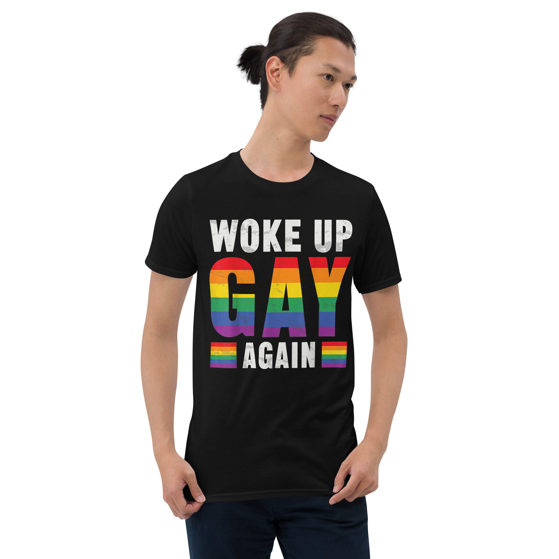 Young man wearing a black t-shirt that reads Woke Up Gay Again in pride colours