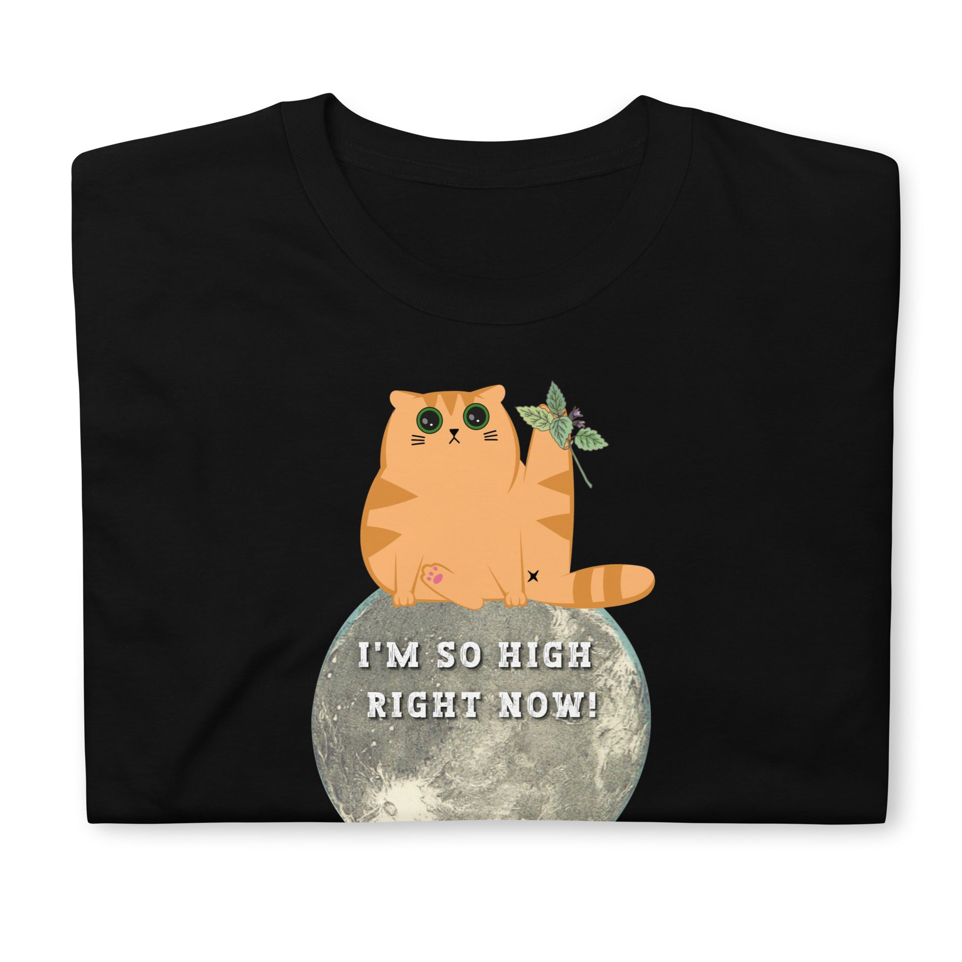 Folded black funny T-shirt featuring a ginger cat sat  on the moon with wide eyes with catnip that reads 'I'm so high right now!'