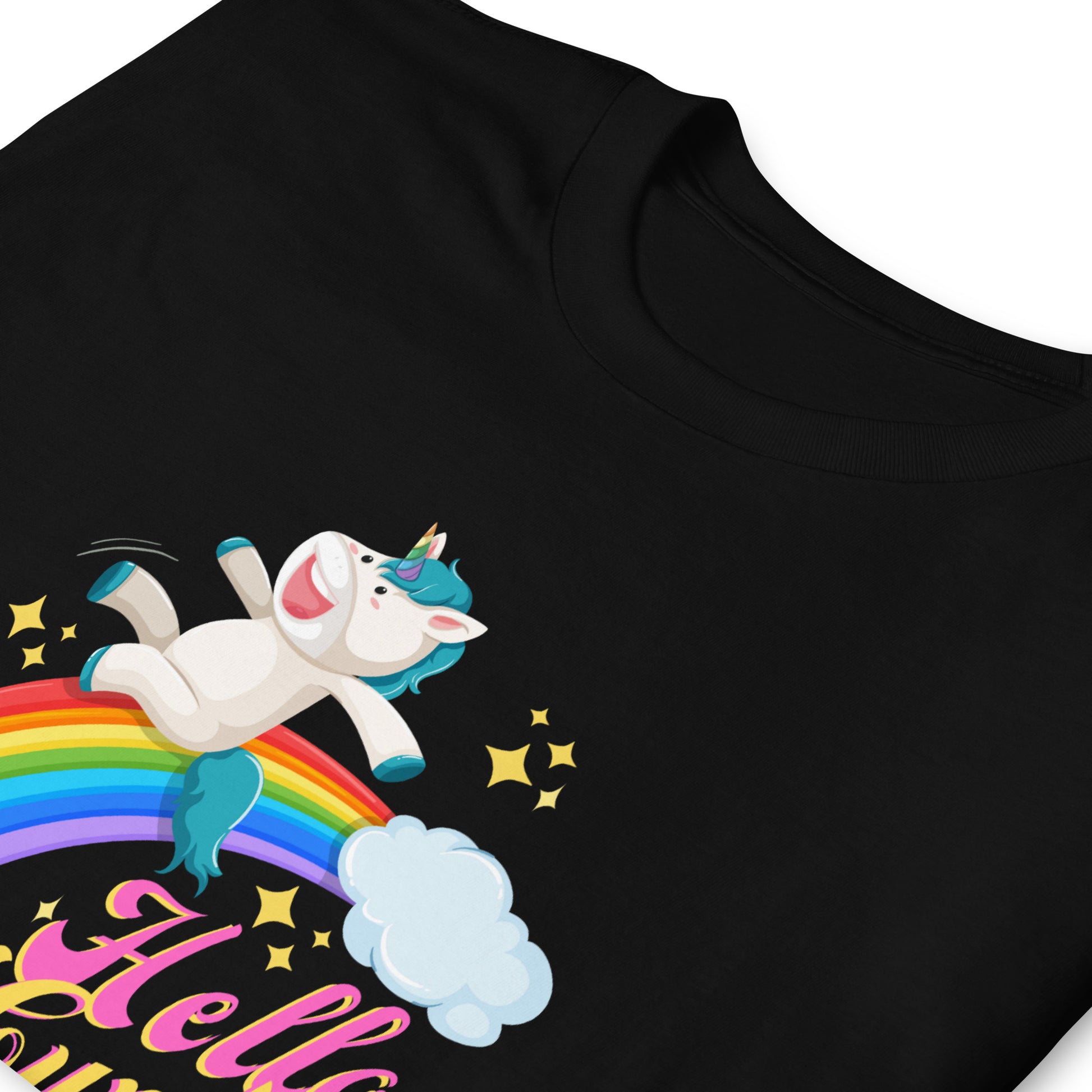 Possibly offensive T-shirt that has a unicorn sliding down a rainbow on it with text that reads Hello Cunty, folded, black.