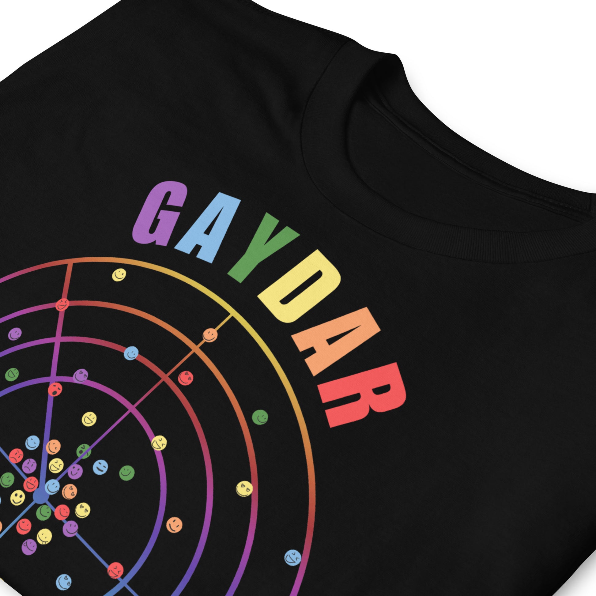 Black LGBTQ T-shirt with GAYDAR in pride colours and a graphic of a radar with lots of colourful dots on it with happy faces. folded.