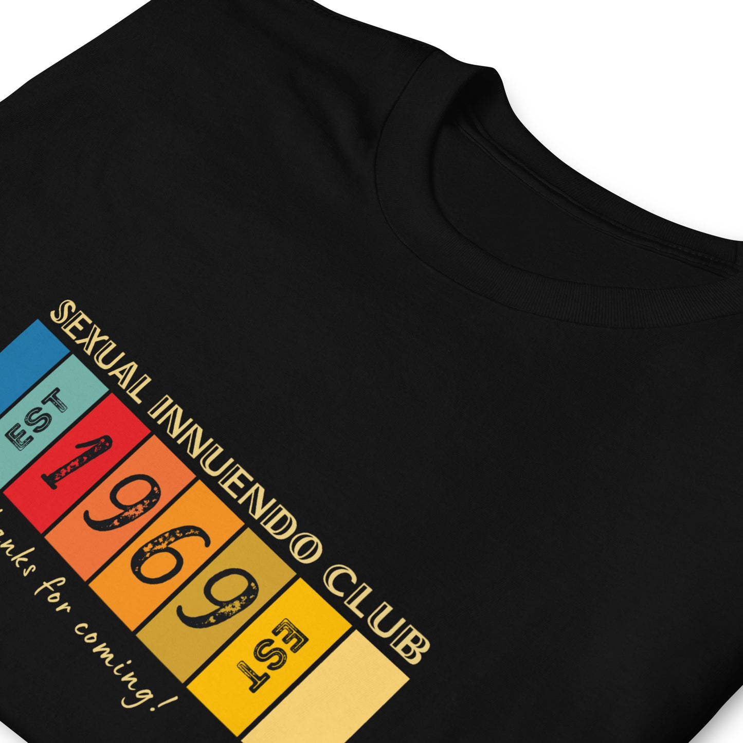 Funny retro T-shirt that reads Sexual Innuendo Club, EST 1969, Thanks for coming! Folded, black.