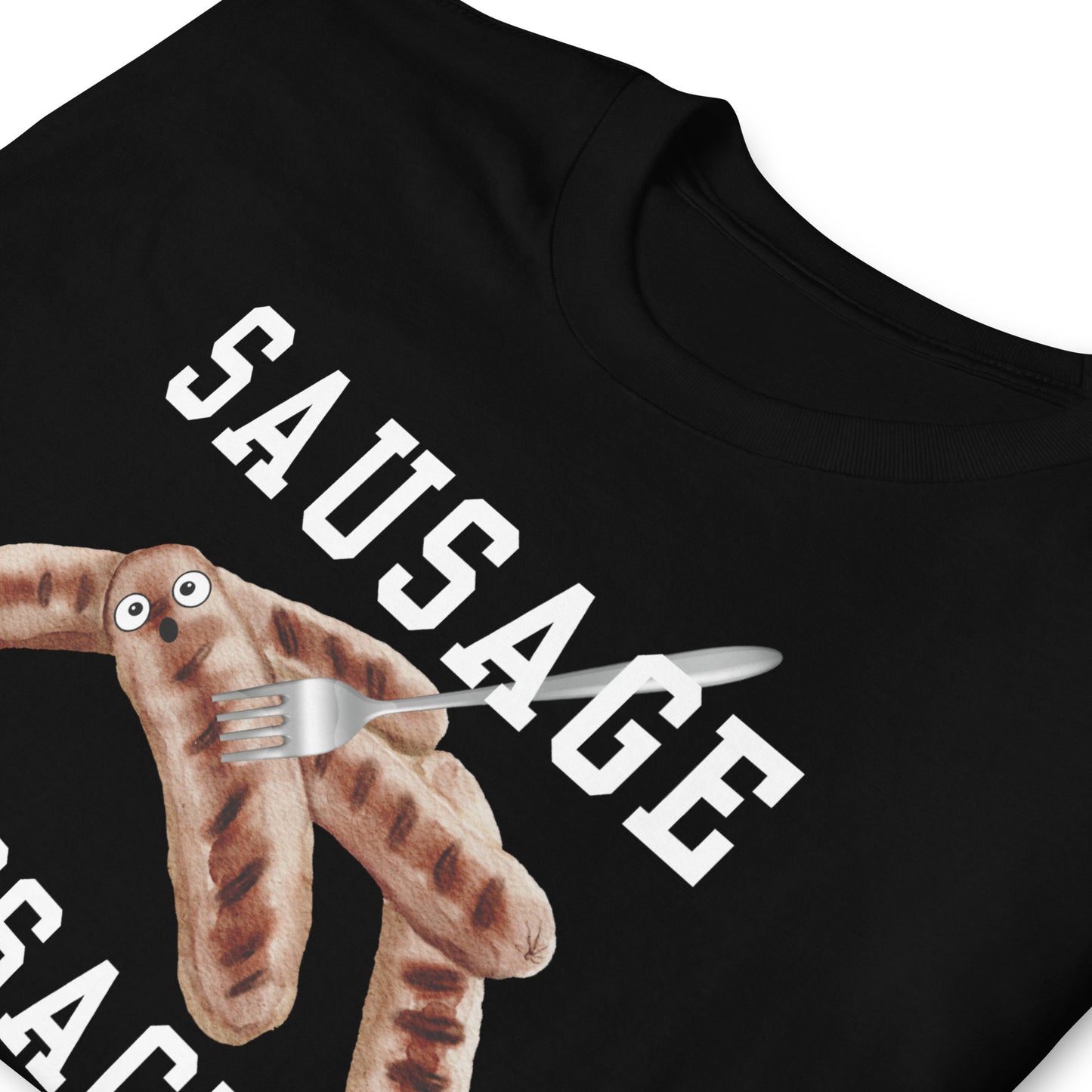 Folded black funny sausage massacre T-shirt with a fork through a shocked sausage.