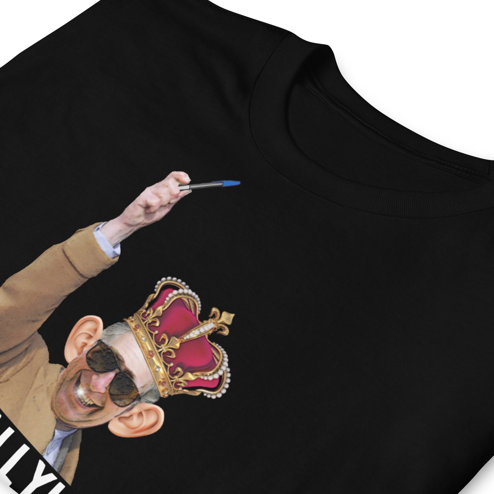 folded black funny King Charles coronation T-shirt with Charles holding up a biro instead of a leaky ink pen, wearing a wonky crown.