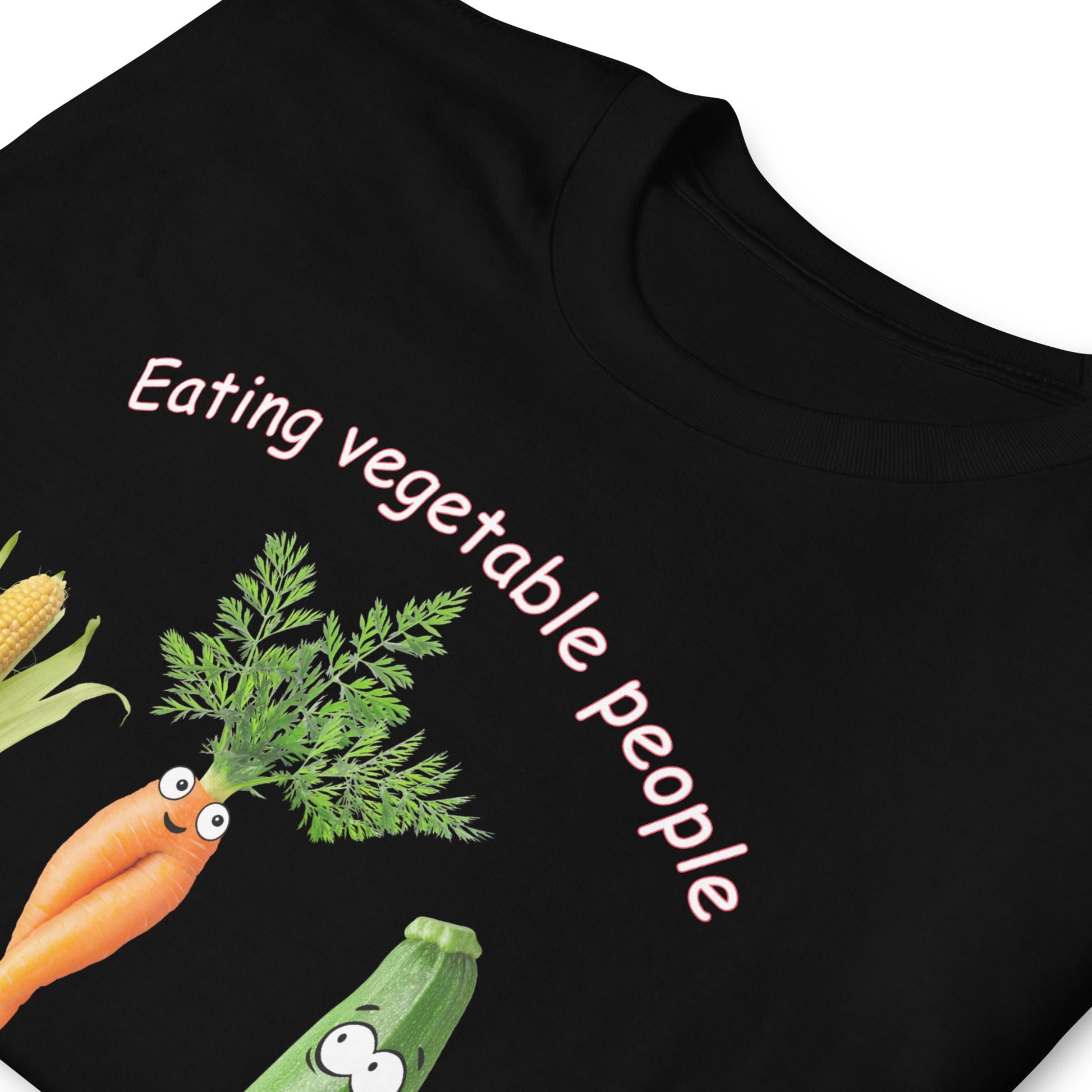 Folded black Eating Vegetable People is Wrong! T-shirt with humanised vegetables.