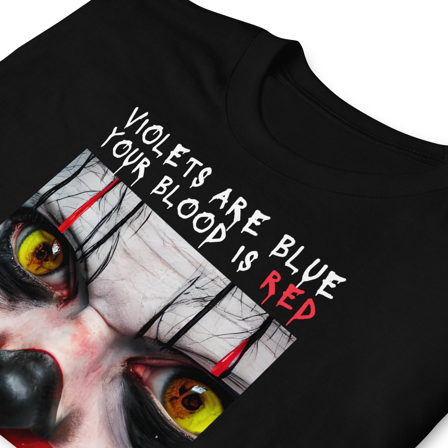 Close up of a black Scary Clown Halloween T shirt that shows a creepy clowns face with text that reads Violets are blue, your blood is red, your window was open, I'm under your bed.