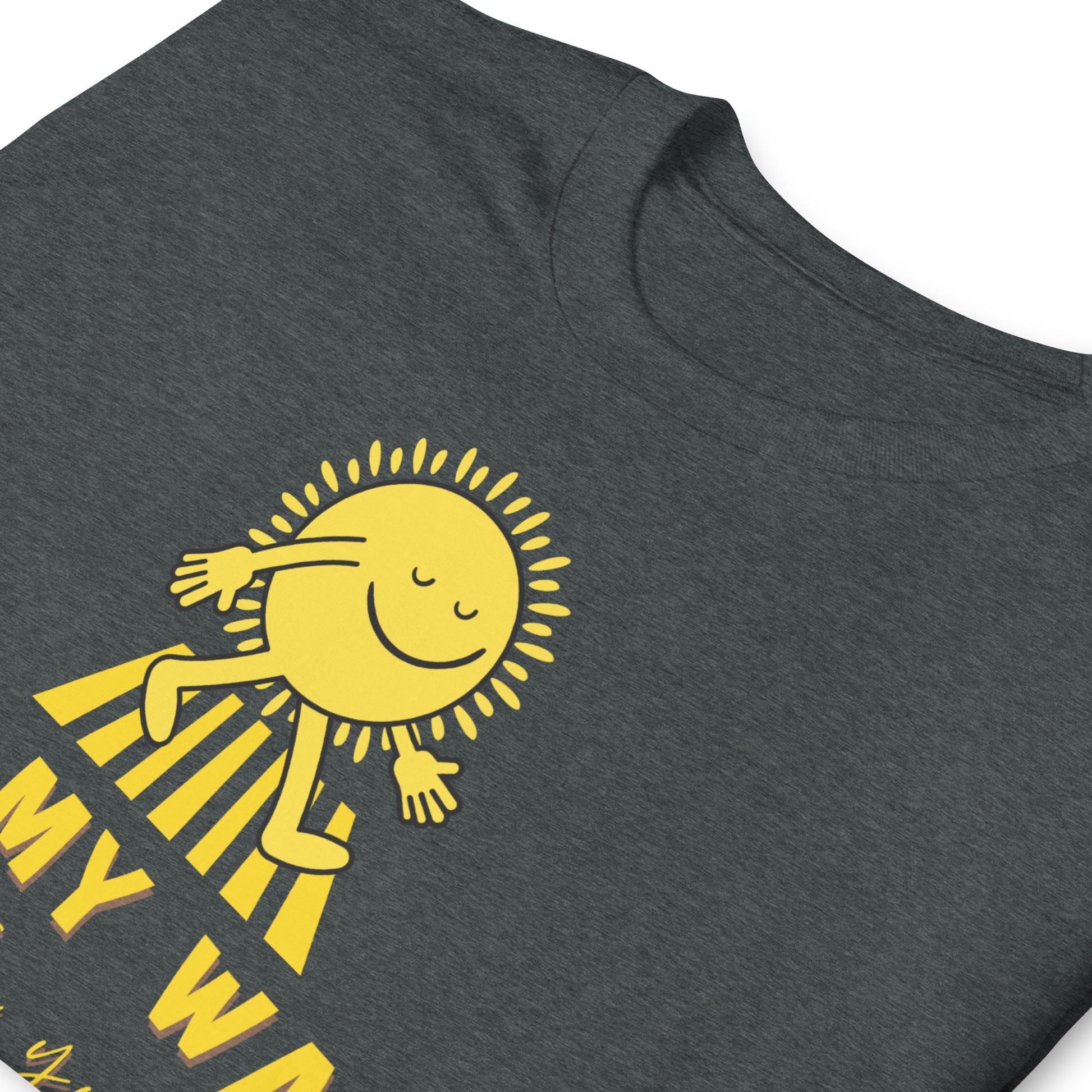 folded dark heather grey T shirt with a walking sun that reads On My Way To Brighten Your Day