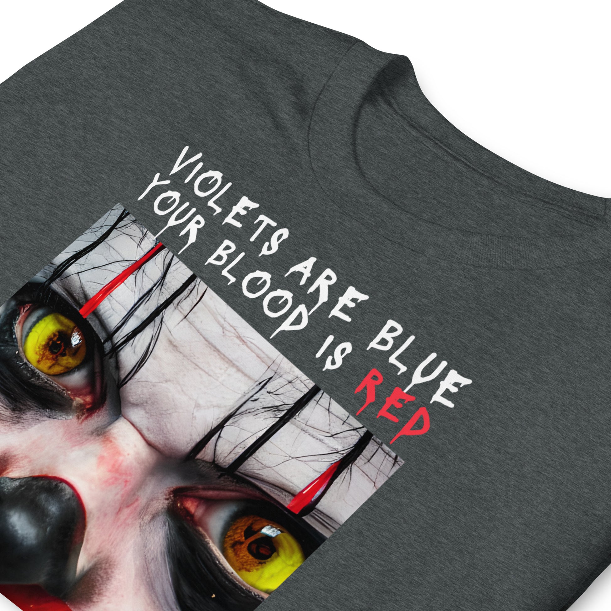 Close up of a dark grey heather Scary Clown Halloween T shirt that shows a creepy clowns face with text that reads Violets are blue, your blood is red, your window was open, I'm under your bed