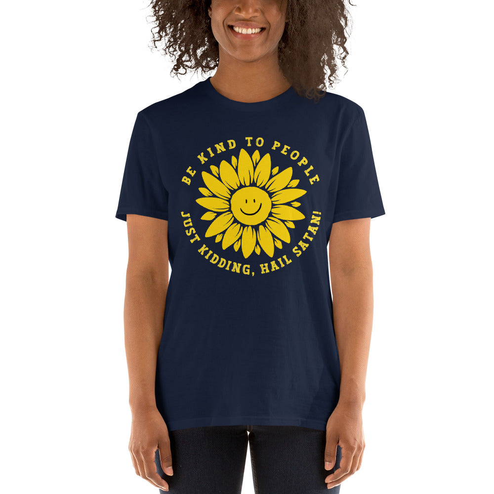 female model wearing a Funny T-shirt with a smiling sunflower design and yellow text that reads, Be Kind To people, Just Kidding, Hail Satan!