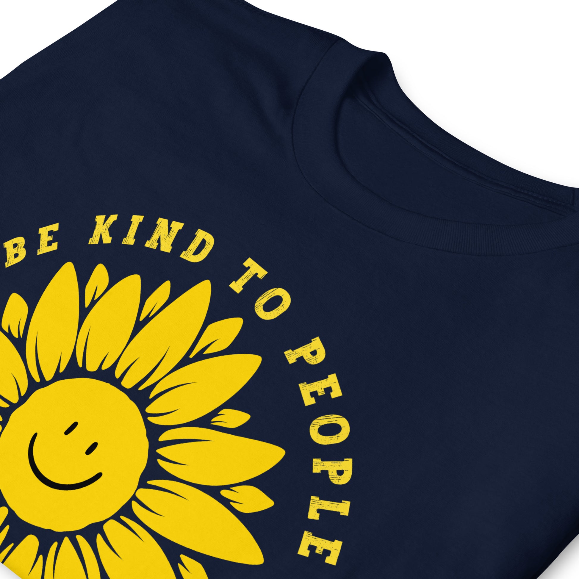 Navy, folded, Funny T-shirt with a smiling sunflower design and yellow text that reads, Be Kind To people, Just Kidding, Hail Satan!