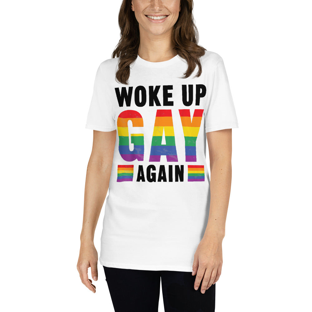 Young woman wearing a white t-shirt that reads Woke Up Gay Again in pride colours