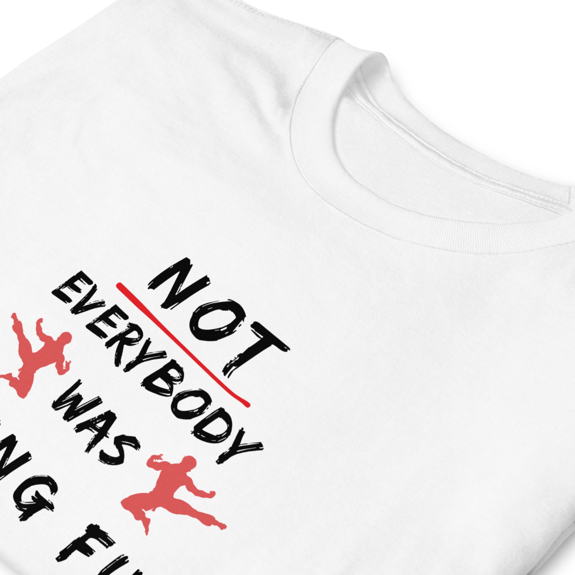 white T-shirt with the text 'Not everybody was kung fu fighting' on the front, folded and laid flat.