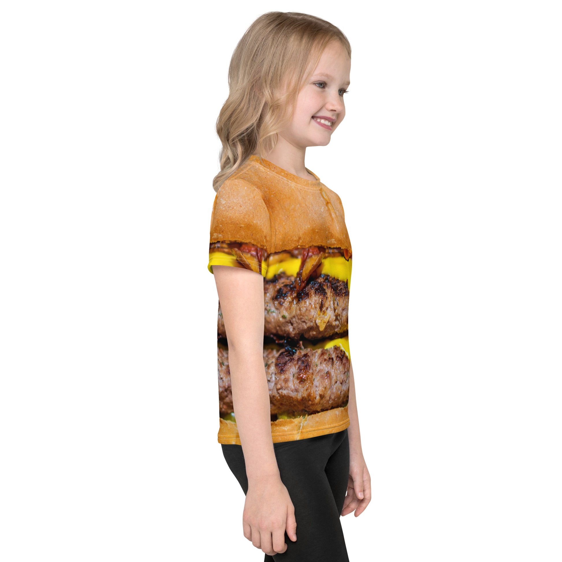 Little girl wearing a Cheeseburger T-shirt with all over print design for kids age 2 to 7 years  right side view.